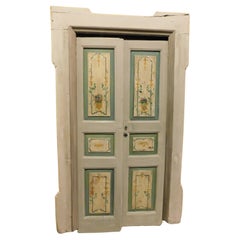 Old small double door, painted with frame, Italy