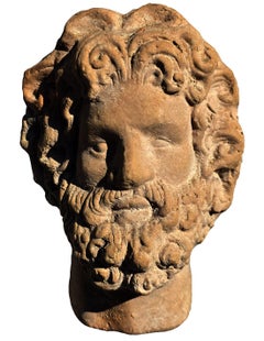 ANCIENNE PETITE TÊTE DE ZEUS EN TERRE CUITE, début du XXe siècle