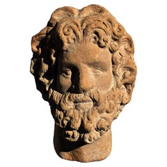 OLD SMALL TERRACOTTA HEAD OF ZEUS, early 20th century
