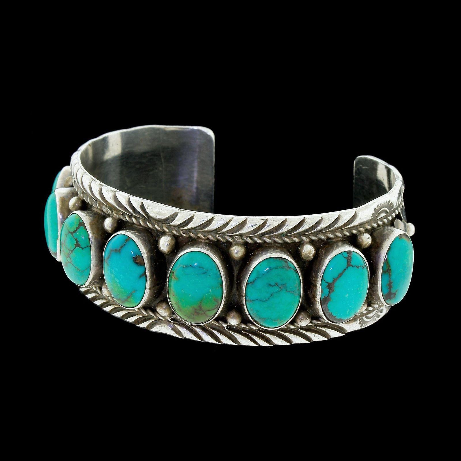 Details & Condition: Vintage signed sterling silver cuff bracelet by Russell Sam in excellent vintage condition.
All eight of the turquoise stones are original and in excellent condition, no chips cracks or replacements, all decorations are original