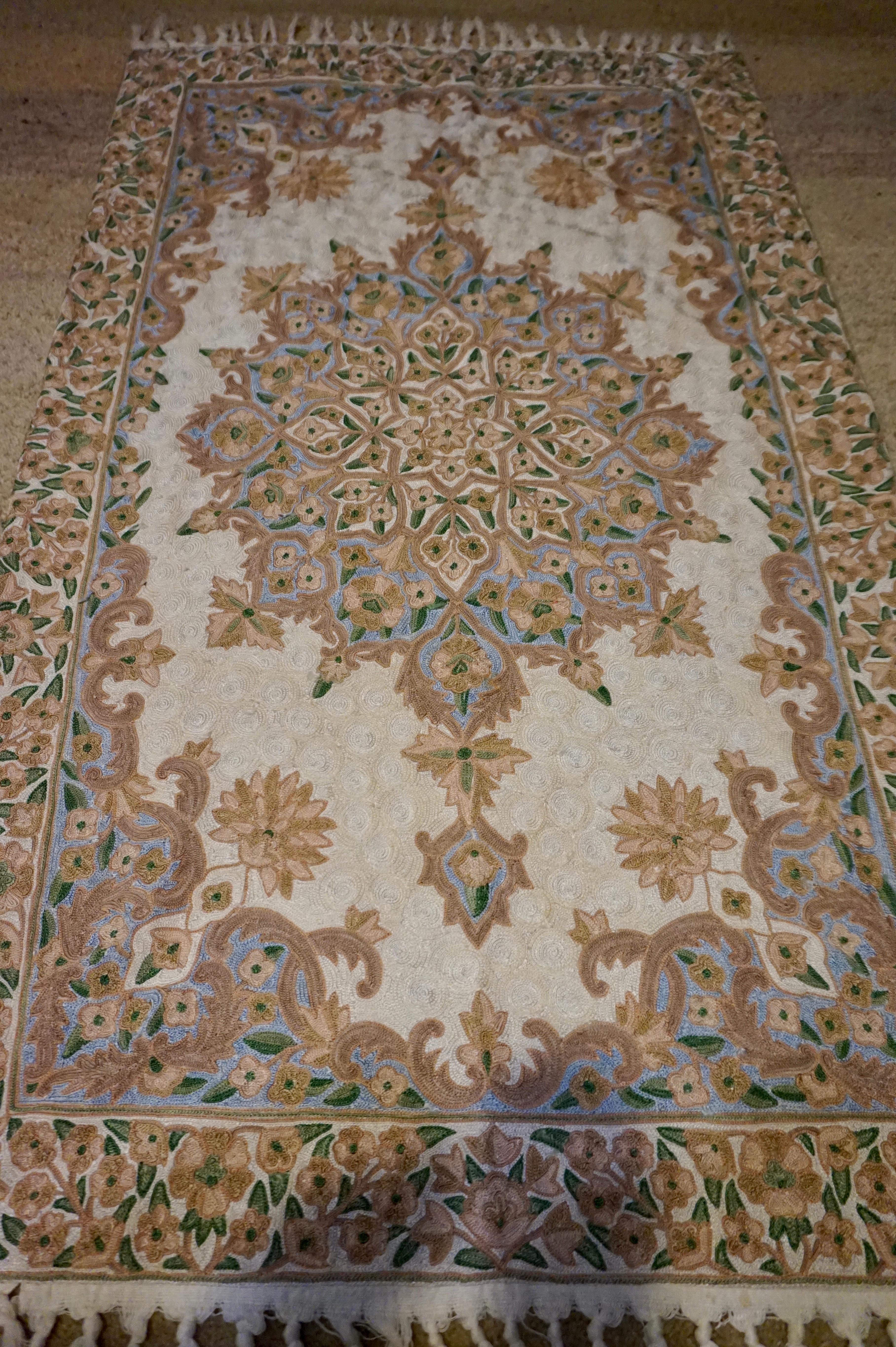 Silk on cotton superfine chain stitch embroidery rug/tapestry. Subtle soft hues and beautiful mosaic pattern. Canvas backed. Handmade. This quality is rarely seen today and is a reminder of their once thriving weaving heritage,

circa 1960s.