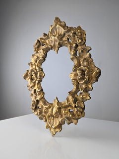 Old stuccoed wooden gilt frame
