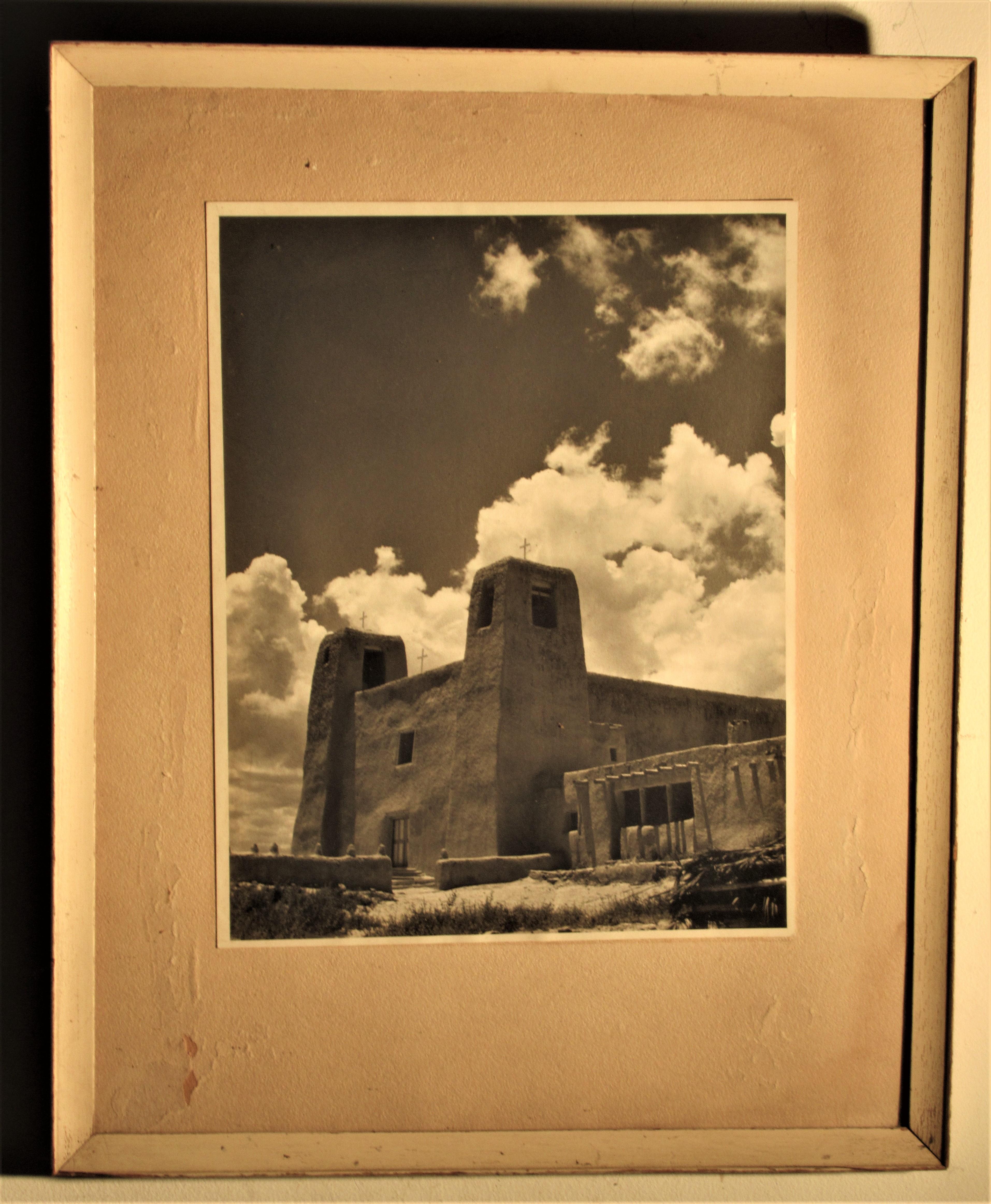Old black and white photograph in the style of Ansel Adams, Taos Pueblo, New Mexico mission church in stark landscape with large cumulus clouds, circa 1940. Look at all pictures and read condition report in comment section.