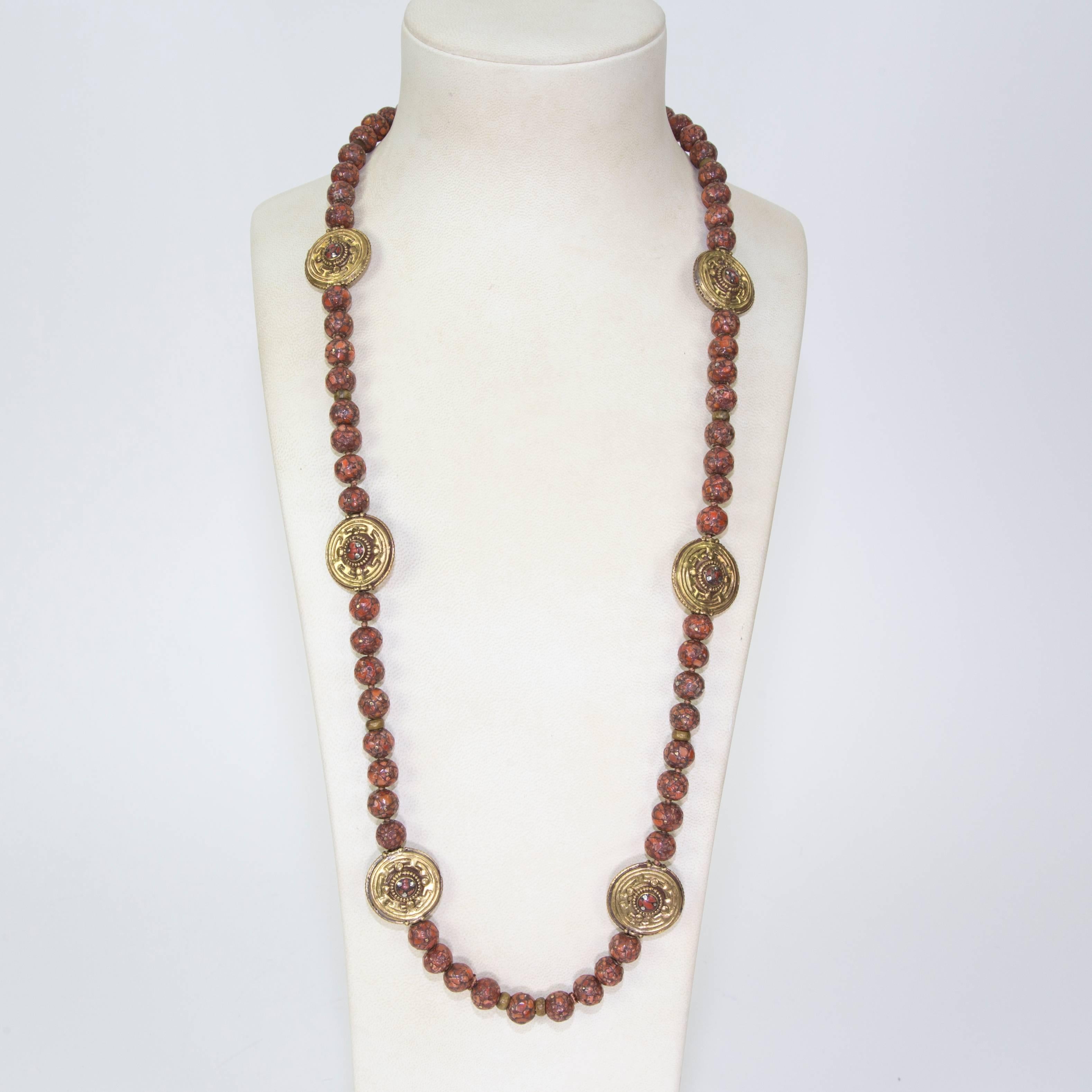 Simply Fabulous long Necklace featuring Old Tibetan reconstructed Coral Heirloom Beads (a gem material made by the fusing small particles of the genuine stone), inter-spaced with nine beautiful circular Gilt Silver beads centered by matching