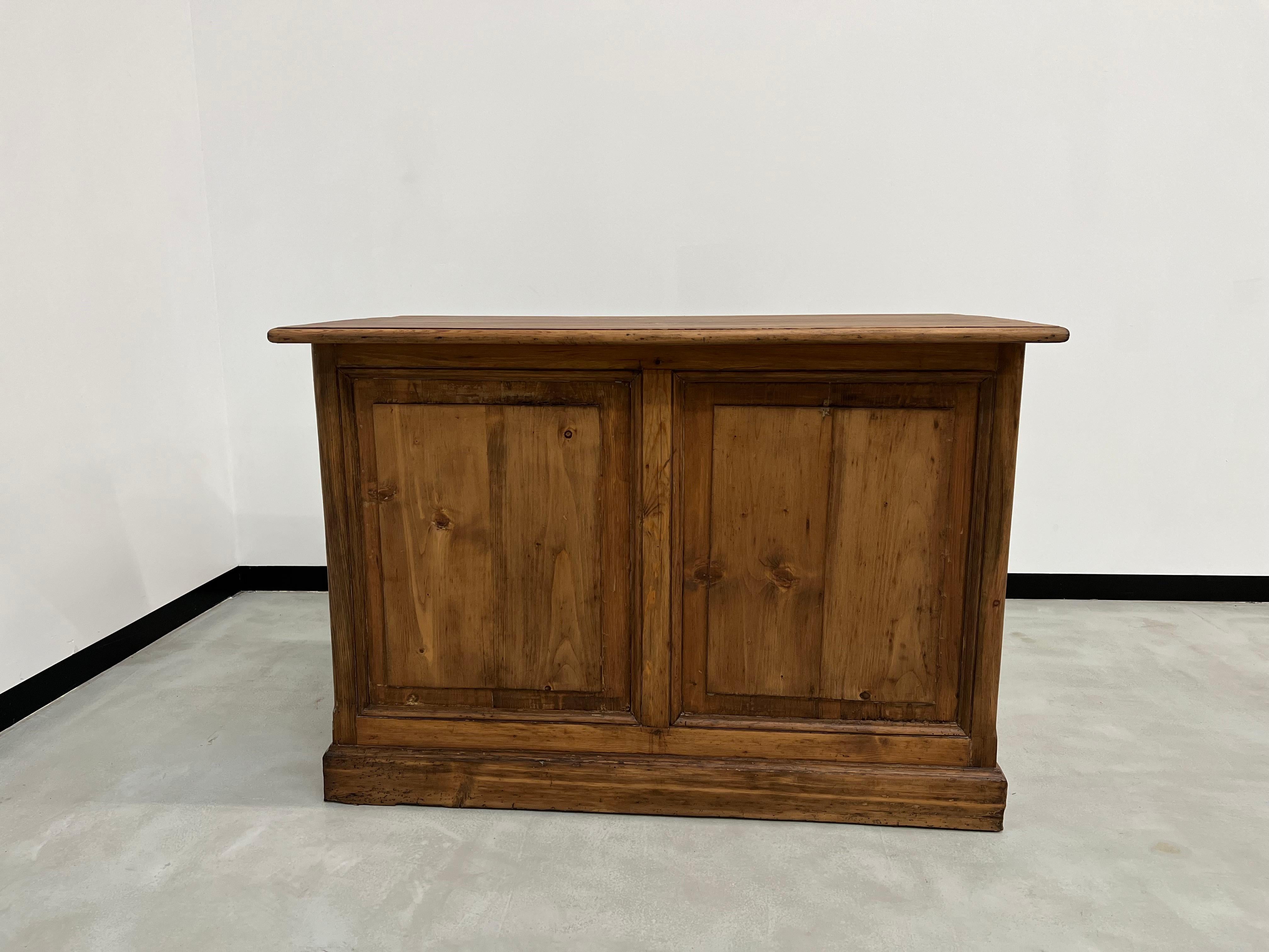 This old trading counter has been completely redone by us and is offered here in a matt varnished version for good daily protection while retaining the patina of the wood. Two large drawers with original cast steel shell handles.

Dimensions: L123 x