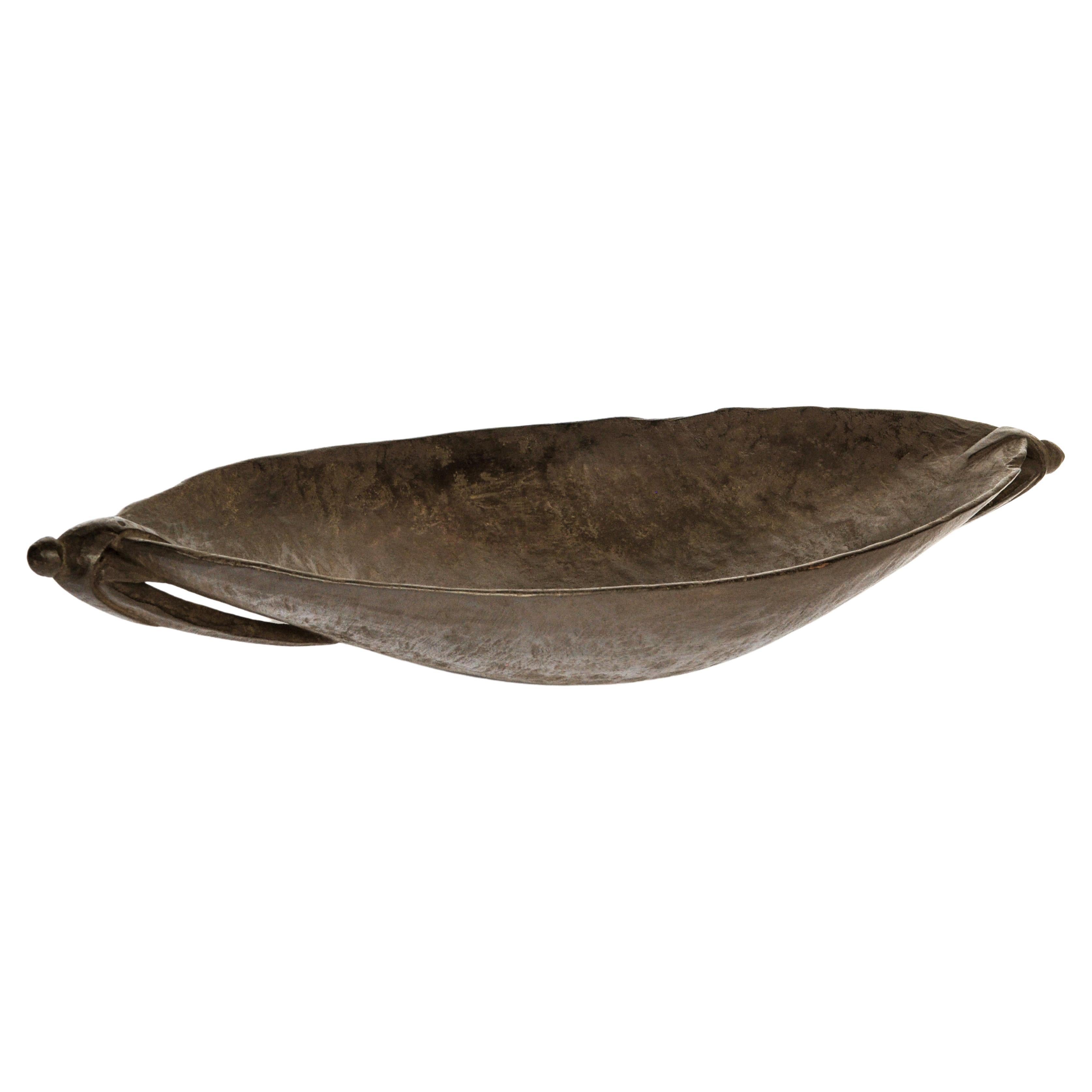 Old Tribal Wooden bowl, Siassi Island Papua New Guinea, Mid-20th Century
Hewn and shaped by hand using basic instruments from a single piece of a very dense local hardwood. It exhibits a graceful shape and a lovely patina, and would have been used
