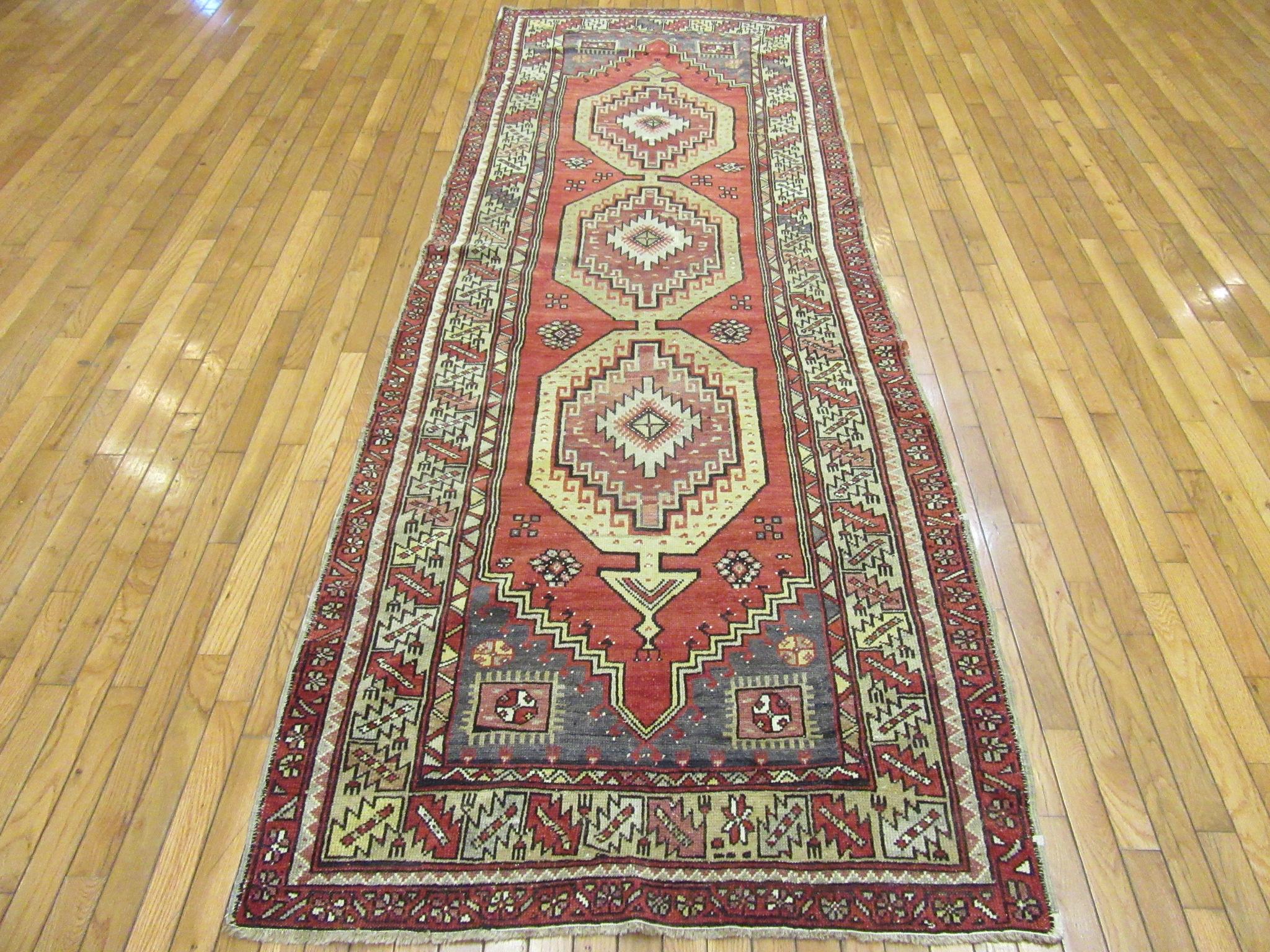 This is a vintage Turkish Anatolian rug made with 100% wool and all natural dyes. Bring life and elegance to your space with this beautiful rug in rich yet soft colors. It measures 3.8” x 10” and in great condition.