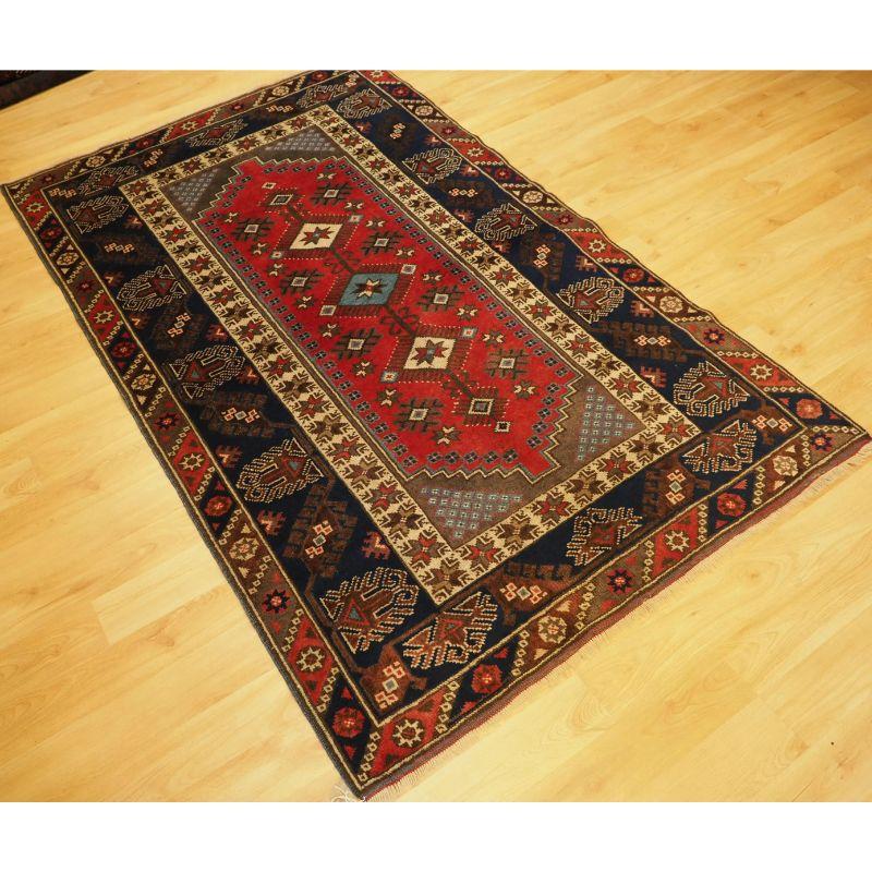 A Turkish Dosemealti rug of the traditional design for this town.

A example with a large central medallion containing three small medallions with stars, with excellent colour including a red with ivory highlights. The border designs are very well