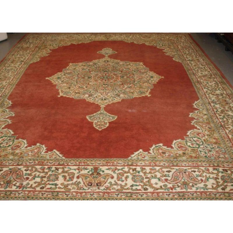 Old Turkish Isparta carpet of traditional medallion design, the carpet has a soft colour palette, with an very soft red ground.

The carpet has a beautifully drawn ivory ground border that contrasts very well with the soft field colour. Both the