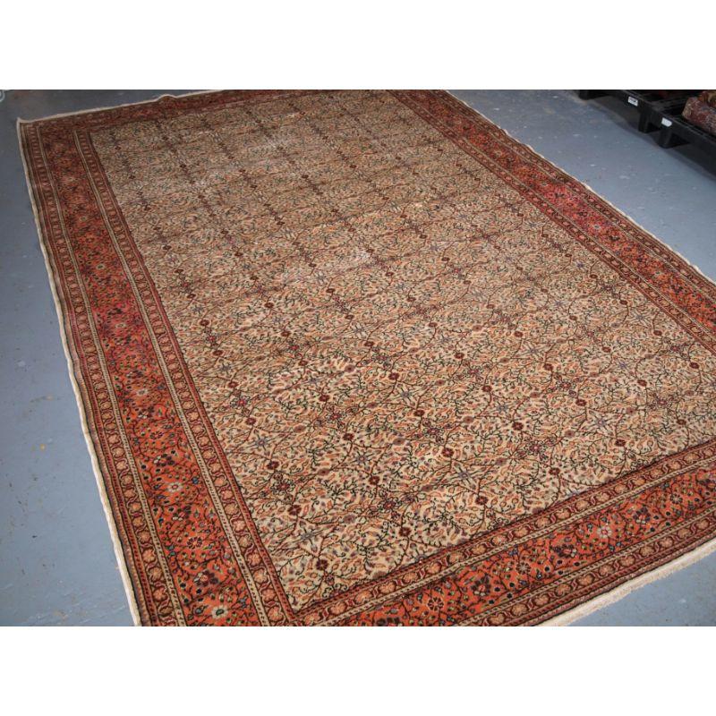 Old Turkish Kayseri carpet with traditional all over floral design on a light ivory ground.

Circa 1930.

The carpet has a light pastel palette with a very fine all over floral design, the border is in a very soft orange colour palette.

The