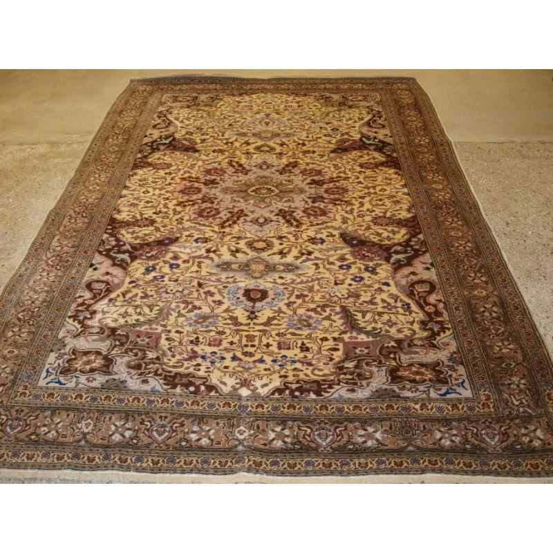 Old Turkish Kayseri rug with traditional medallion design on a light ivory ground.

The rug has a light pastel palette with a very fine all over floral design, The central medallion is quite small and does not dominate the rug.

The rug is in