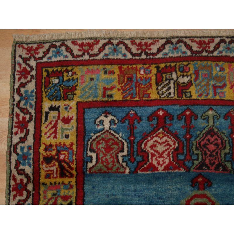 Old Turkish Kirsehir village prayer rug of classic design with good colour.

The rug has very pleasing colours including soft red, a superb yellow and a nice light blue. The rug is of a traditional Kirsehir design.

The rug is in excellent