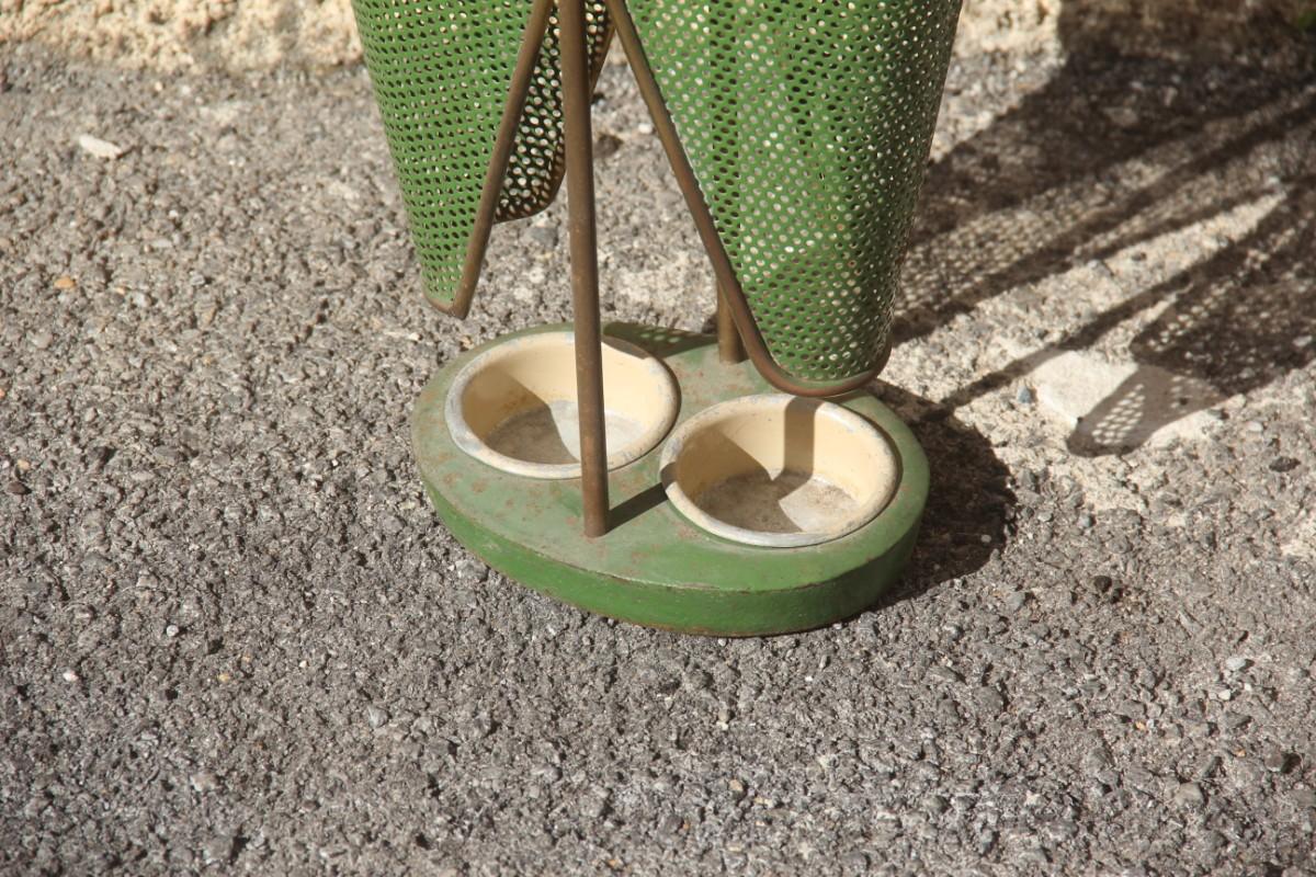 Old umbrella stand midcentury Italian design perforated metal and brass gold green.
On request the brass part can be polished, without any additional cost.