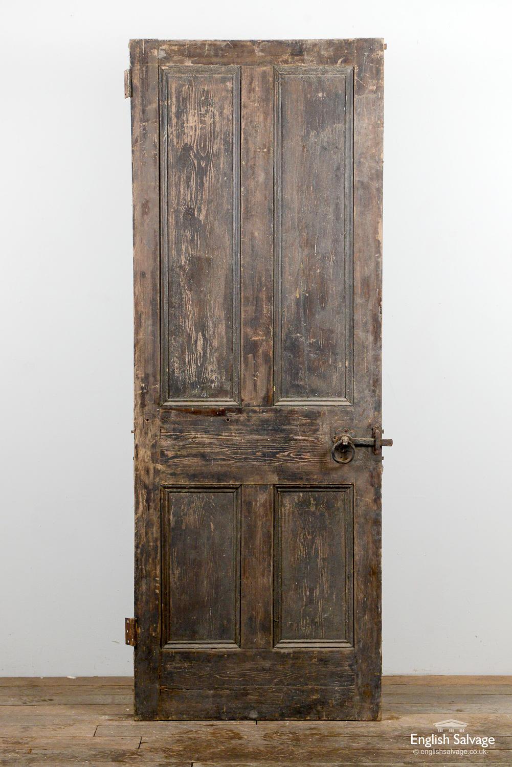 Reclaimed old pine Victorian door with four panels. Splits to rails and panels. Two hinges plus handle, lock and nail holes.