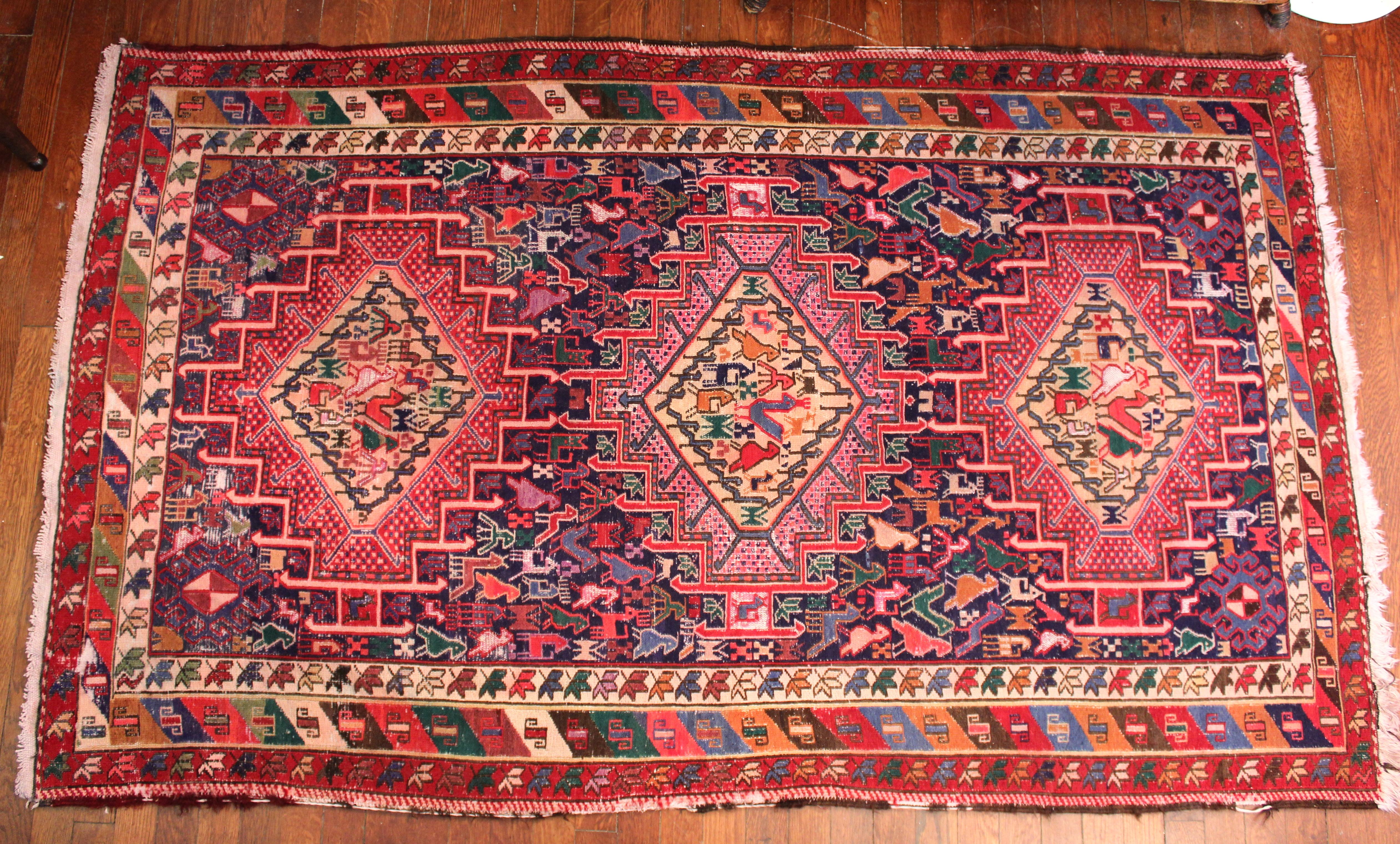 Old vintage Caucasian Kazak rug with dozens of animals and birds on a three star pattern. About 40 years old. 46
