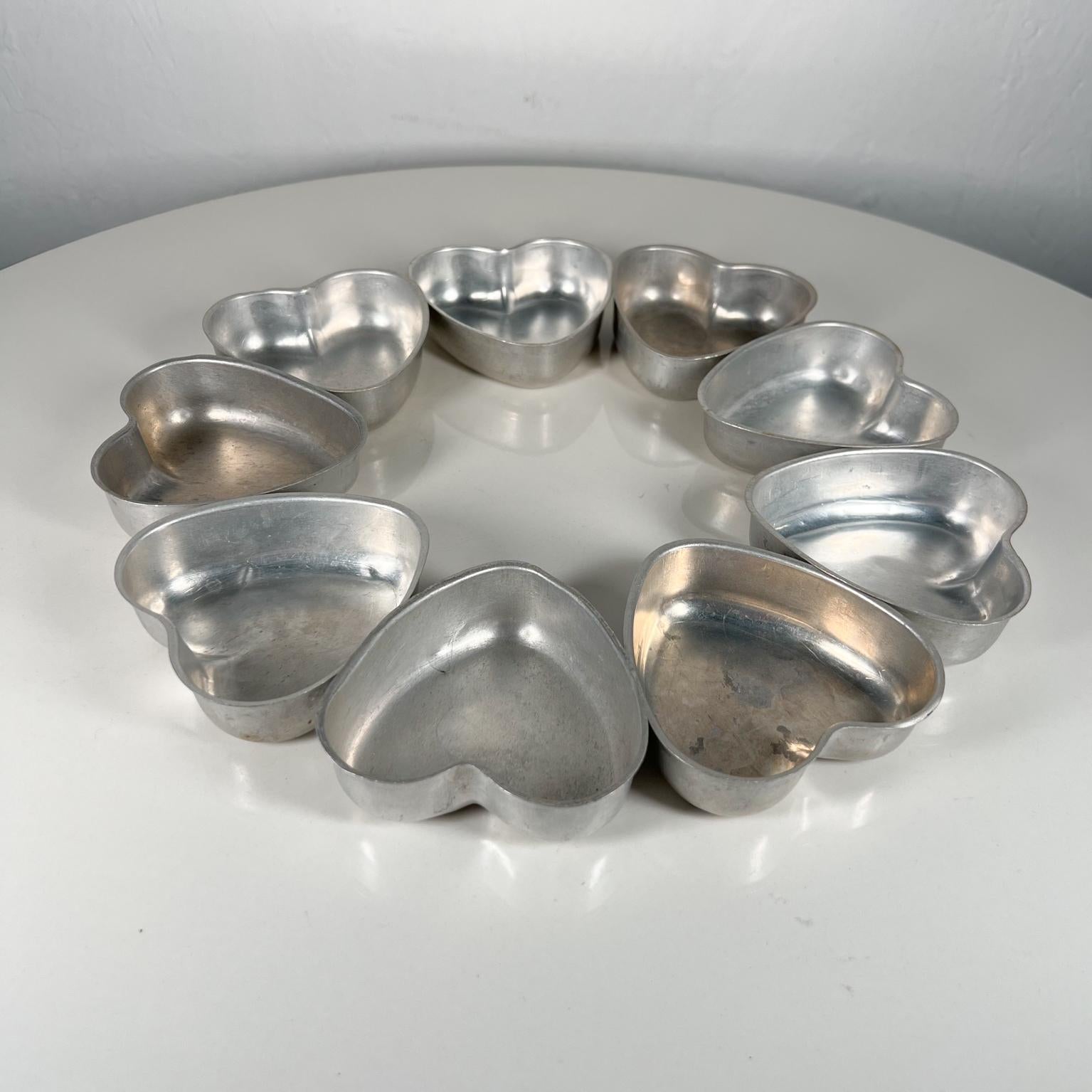 Old Vintage small tin aluminum hearts cake tart pans set of nine
3.38 d x 3.38 w x 1 tall
Unrestored preowned original vintage condition, review images please.