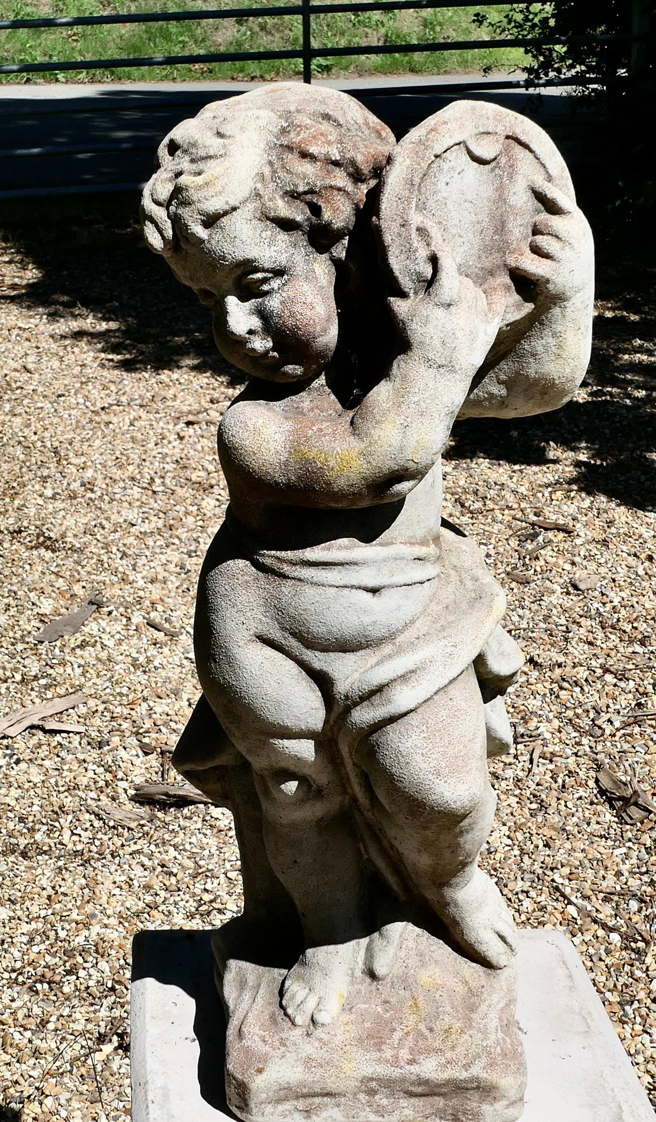 Old Weathered Statue of a Putti Playing Tambourine 

The musical nymph is set on a square base
This is a pleasantly weathered piece in good detail to be viewed from all sides 
The Statue is 24” high and about 10” x 8”  
SW131