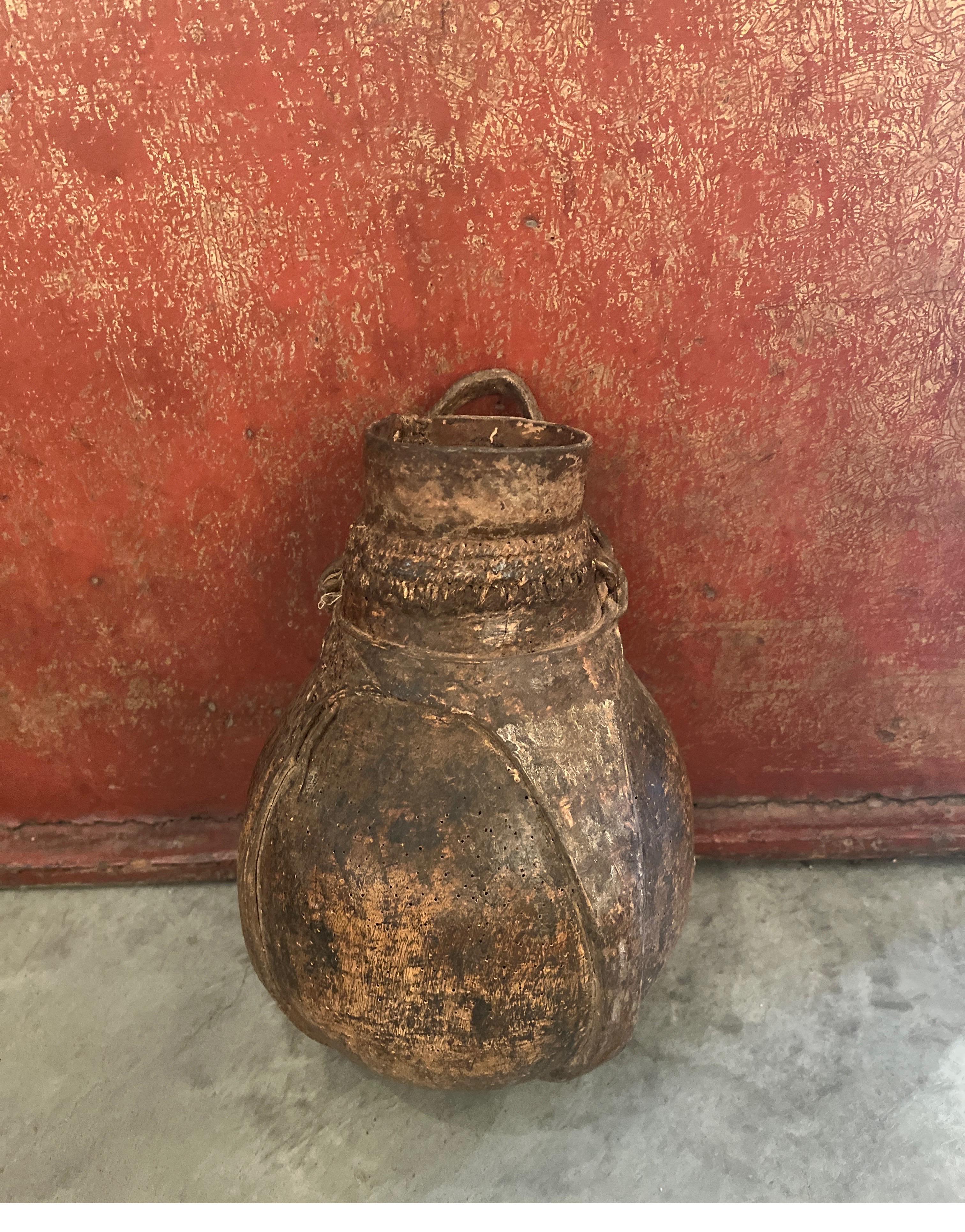 20th Century Old Weathered  Wood And Leather Container With Metal Repair From Africa For Sale