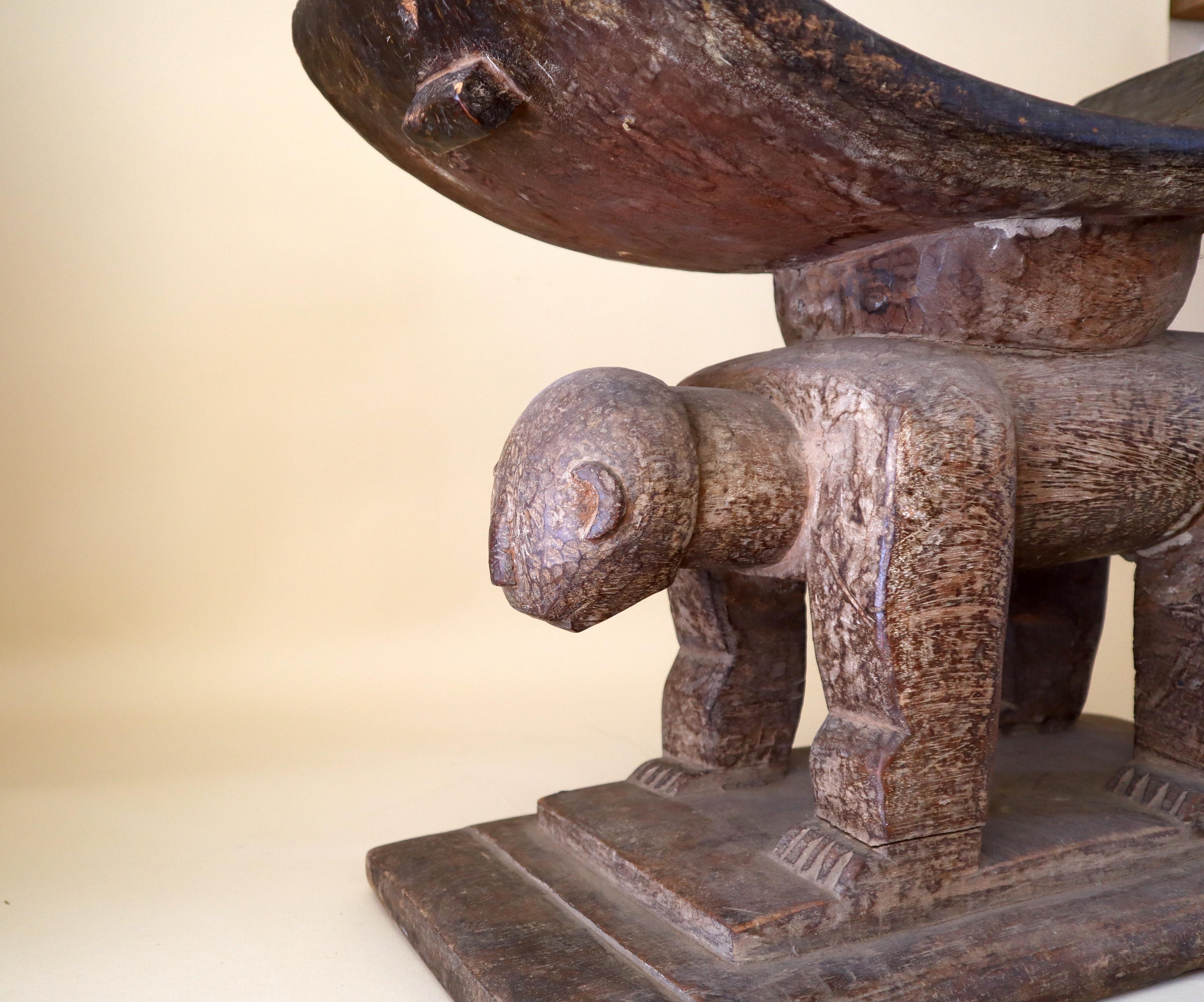 What separates this from the standard Akan stool or seat is the way the artist has used the wood grain to give texture and color to the leopard.
From Ghana, early to middle part of the 20th century.
The Akan people include the Ashanti and the