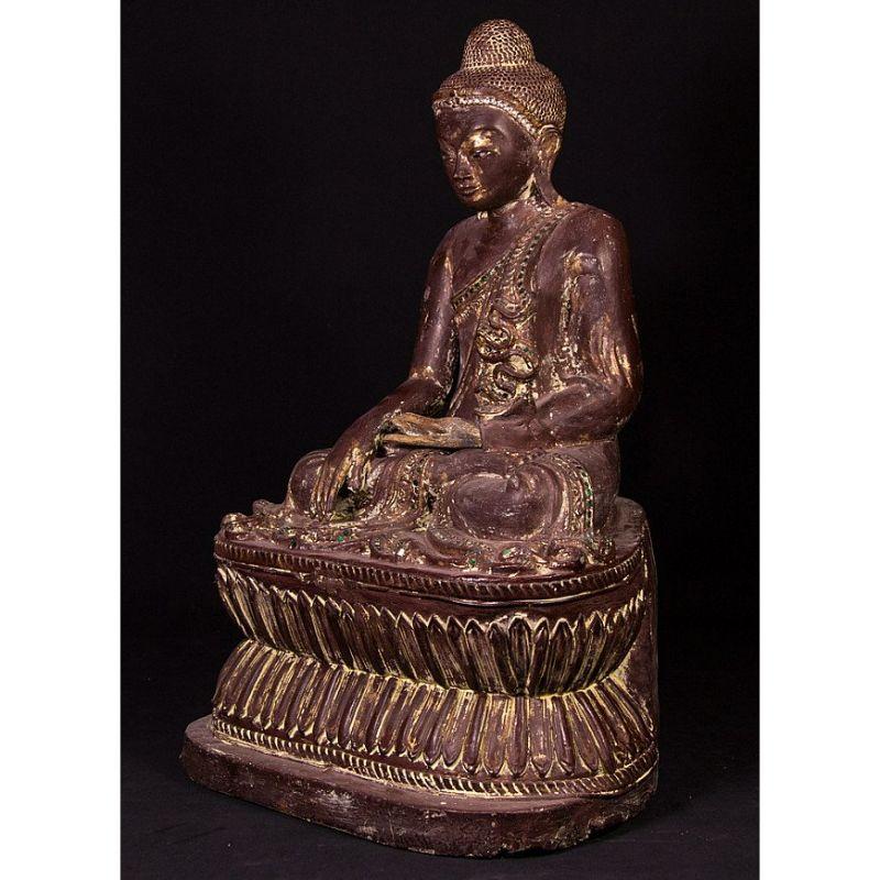 Material: wood
58 cm high 
36 cm wide and 30 cm deep
Weight: 11.45 kgs
With traces of original 24 krt. gilding
Mandalay style
Bhumisparsha mudra
Originating from Burma
Early 20th century
With inlayed eyes.
 