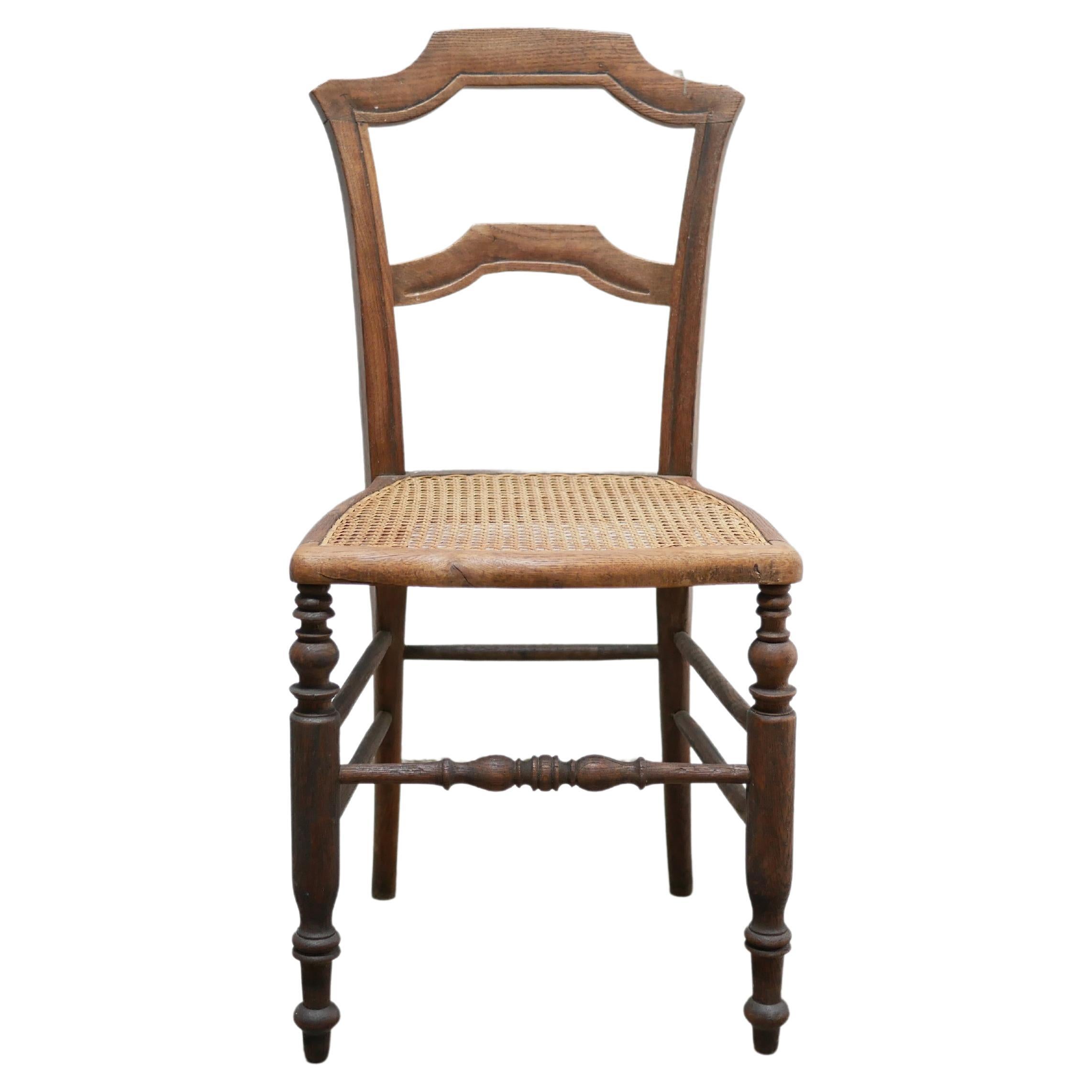 Old wooden cane chair For Sale