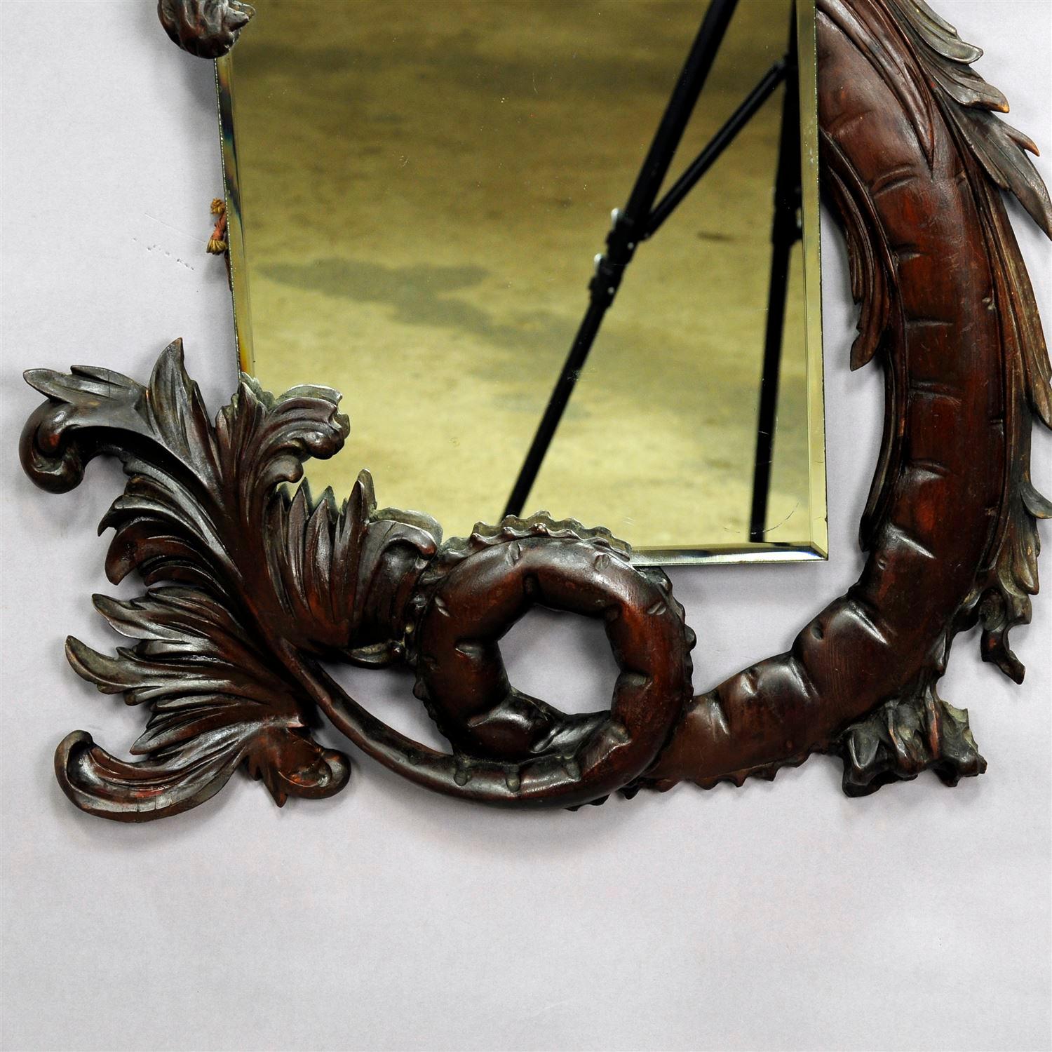 A decorative mystical wooden caved dragon mirror. Executed circa 1900, very good condition, original antique mirror glass.

Measures: Width mirror: 11.8' inches (30 cm)
Height mirror: 20.5' inches (52 cm)
Width overall: 33.86