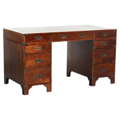 Old wooden English desk from the early 20th century with brass elements