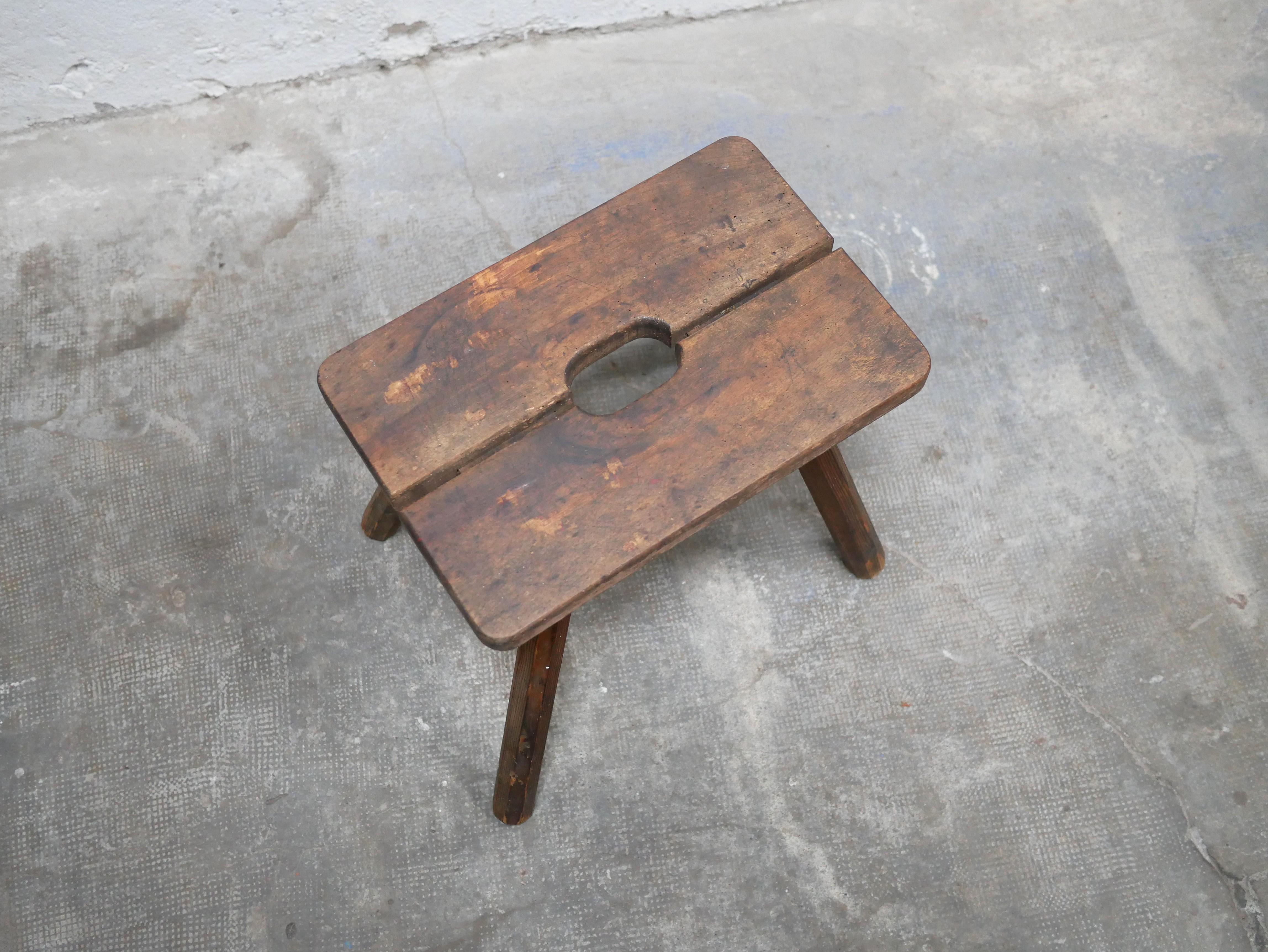 Wood Old wooden farm stool