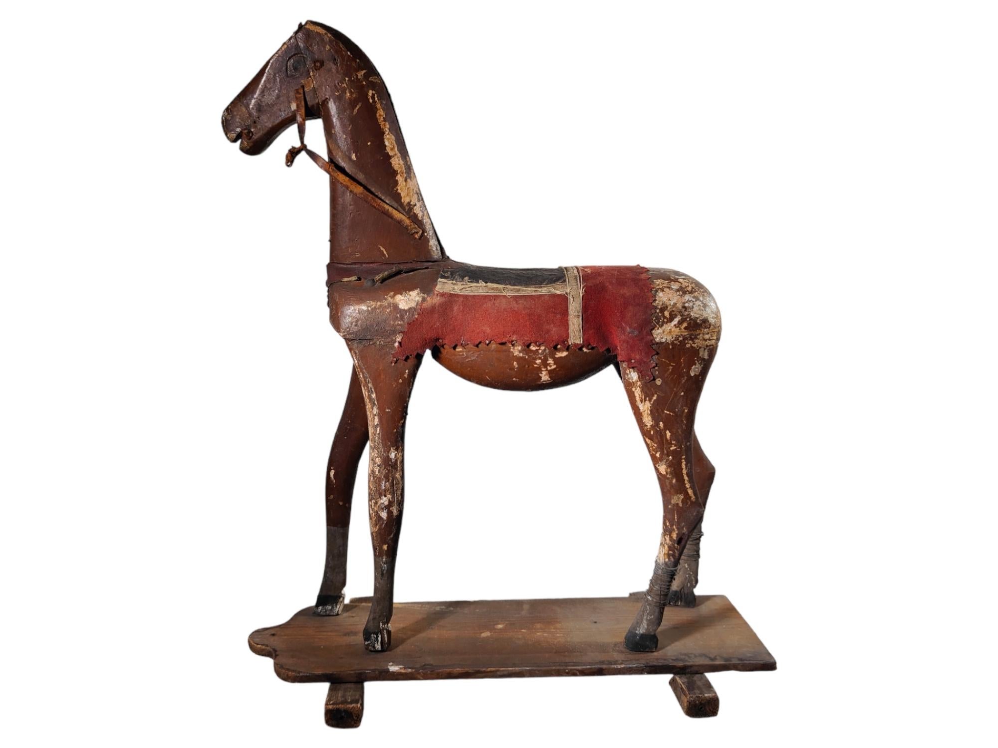 Old wooden horse 19th century.
19th century Wooden horse. It has many use and can be used as a decoration. He has very surrealistic long legs. It is made of painted wood. In its original condition. Measurements: 70x60x24cm.