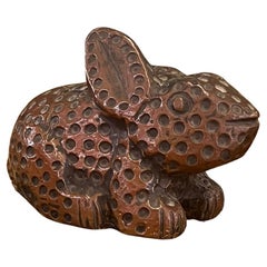 vintage handmade wooden rabbit with possible copper wrapping exterior