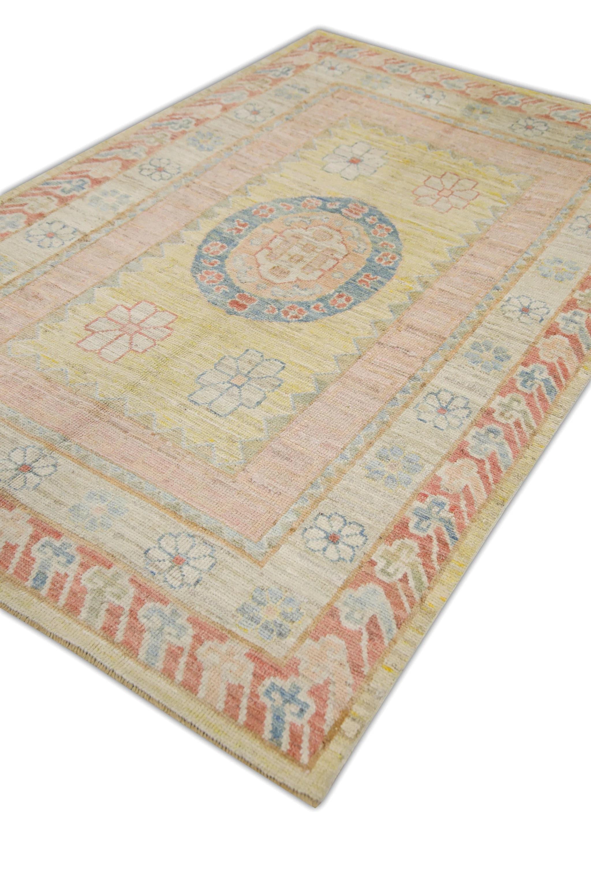 This modern Turkish Oushak rug made from reclaimed vintage wool is a stunning piece of art that has been handwoven using traditional techniques by skilled artisans. The rug features intricate patterns and a soft color palette that is achieved