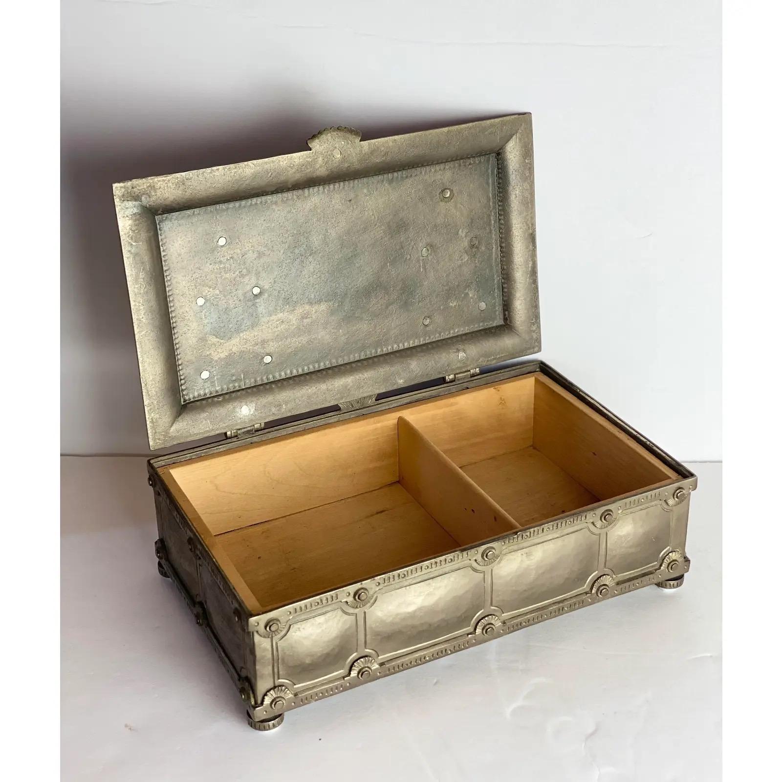We are very pleased to offer an Old-World silver metal decorative box, circa the 1900s. The soldering process showcases to be extremely labor intensive to achieve the delicate and perfect detailing that surrounds this piece. The hinged top easily