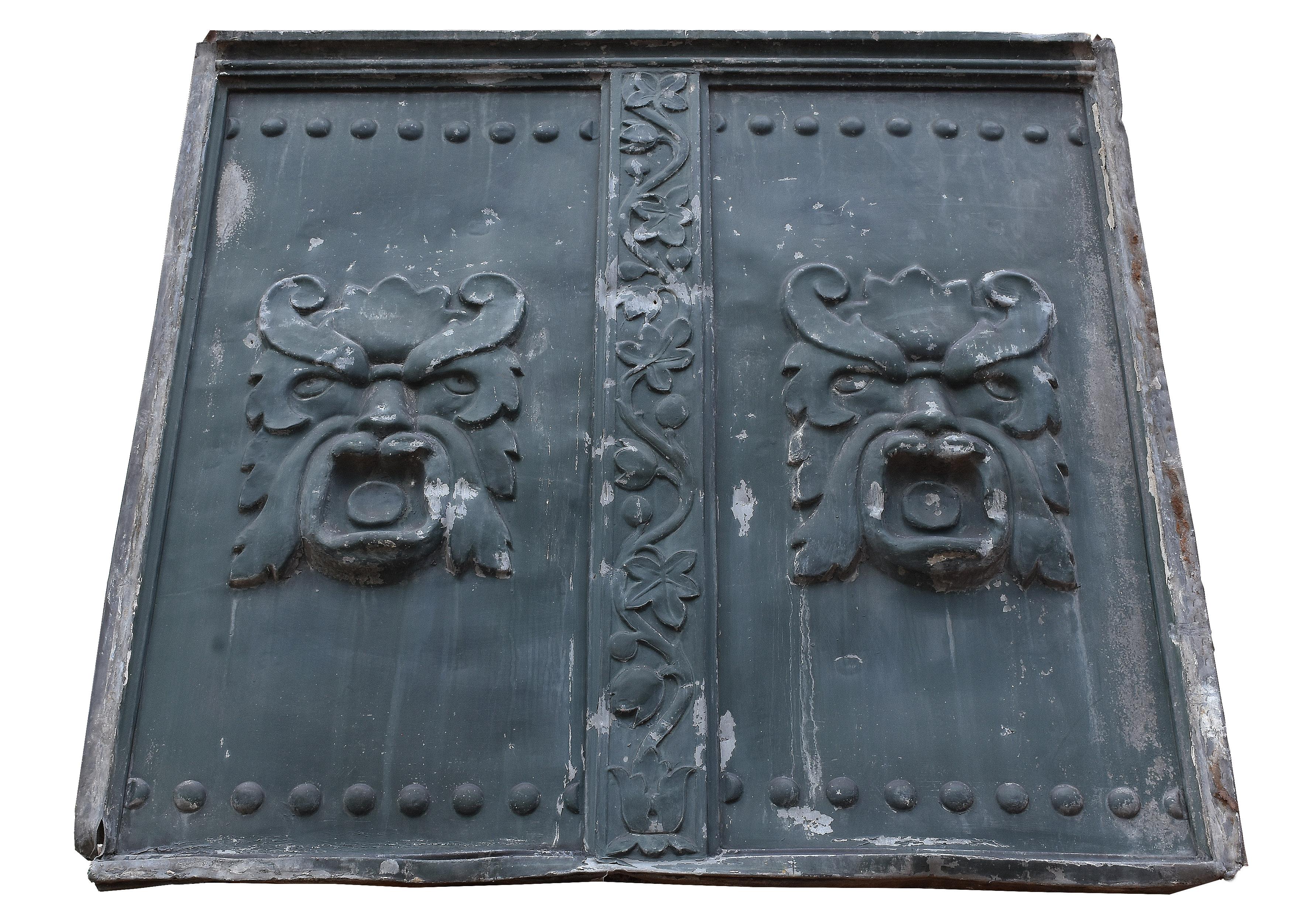 These impressive pressed metal building panels once adorned the side of a Chicago skyscraper. They feature the face of the “north wind” blowing air. This kind of face can be found throughout Gothic Revival architecture, more often on buildings where