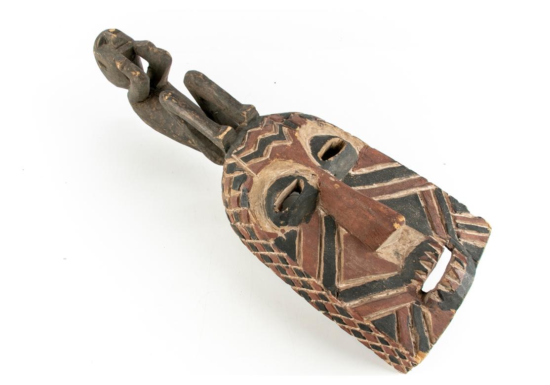 Older African Dance Mask Surmounted With A Sitting Figure (20. Jahrhundert) im Angebot