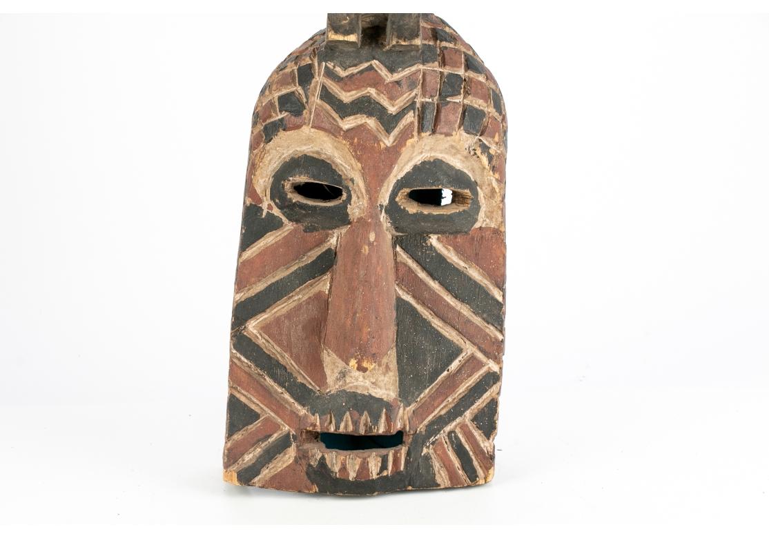 Older African Dance Mask Surmounted With A Sitting Figure (Holz) im Angebot