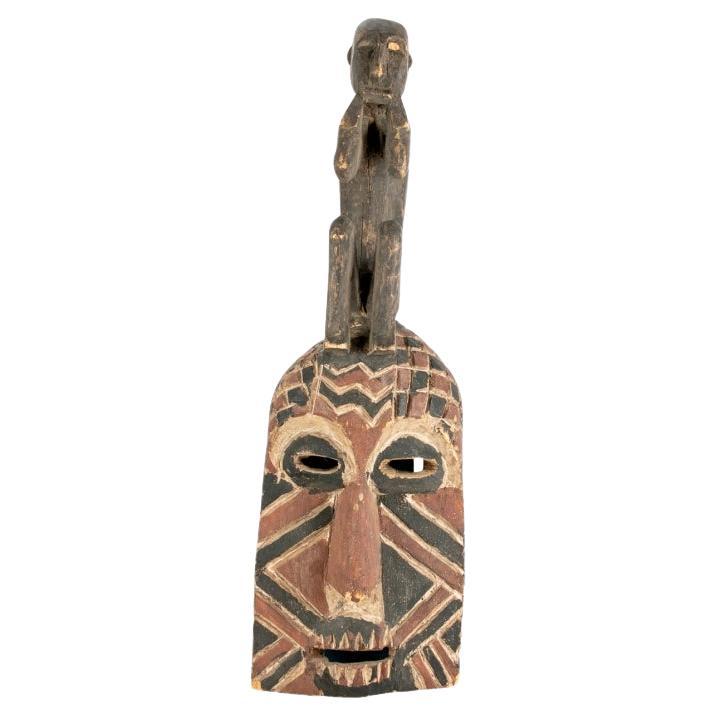 Older African Dance Mask Surmounted With A Sitting Figure