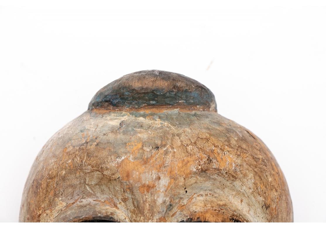 Older Yoruba African Carved and Painted  Mask, Labeled In Distressed Condition For Sale In Bridgeport, CT