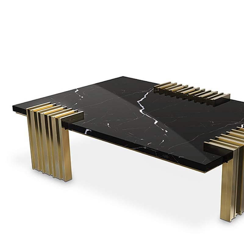 Coffee table oldies with 3 feet base in gold
plated solid polished brass. With black marble top.