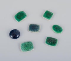 Ole Bjørn Krüger. 28 unique brooches in glazed stoneware in green shades.