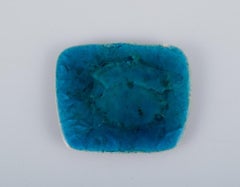 Ole Bjørn Krüger. Seven brooches in glazed stoneware in blue and green shades.