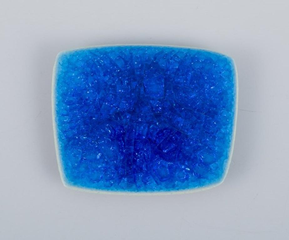 Modern Ole Bjørn Krüger. Seven brooches in glazed stoneware in blue and green shades. For Sale
