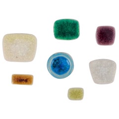 Ole Bjørn Krüger. Seven unique brooches in glazed stoneware in different colors.