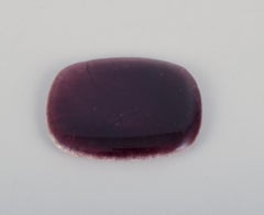 Ole Bjørn Krüger. Six unique glazed stoneware brooches in blue and purple hues.