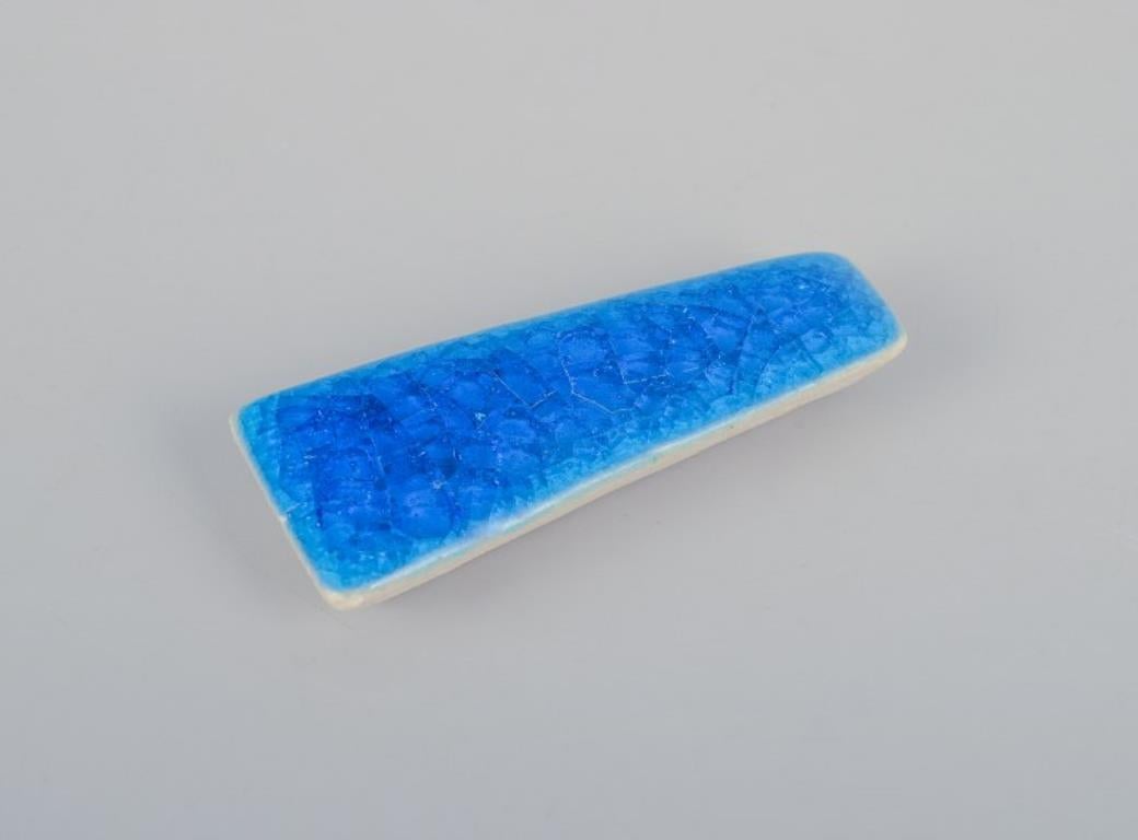Women's Ole Bjørn Krüger. Ten unique brooches in glazed stoneware in blue shades. For Sale