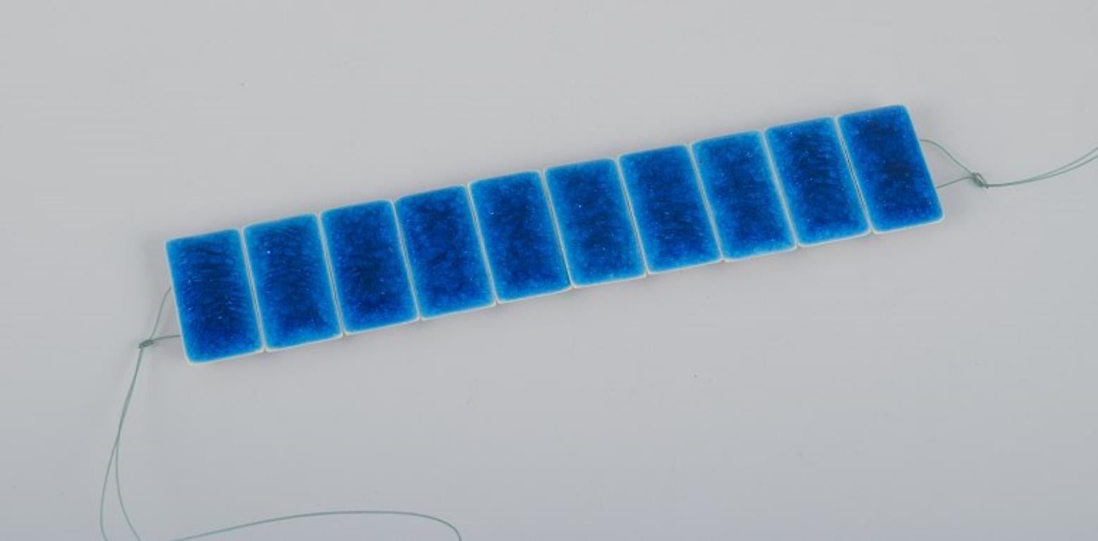 Ole Bjørn Krüger (1922-2007), Danish sculptor and ceramicist.
Unique stoneware bracelet in blue shades.
1960s/70s.
In excellent condition.
Partially marked.
Provenance: Estate of sculptor and ceramist Ole Bjørn Krüger.
Dimensions: L 16.2 cm x W 3.2