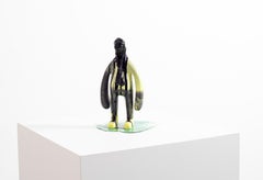 «Everything is liquid» resin sculpture of a man covered in pitch black liquid