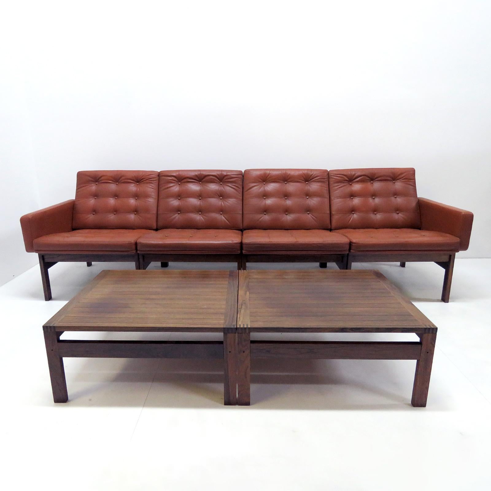 Moduline sofa set designed by Ole Gjerlov Knudsen & Torben Lind, manufactured by France & Son, Denmark 1962. This modular set contains four seating elements, (two of which with one arm each) and two low solid rosewood side tables. The sofa has a