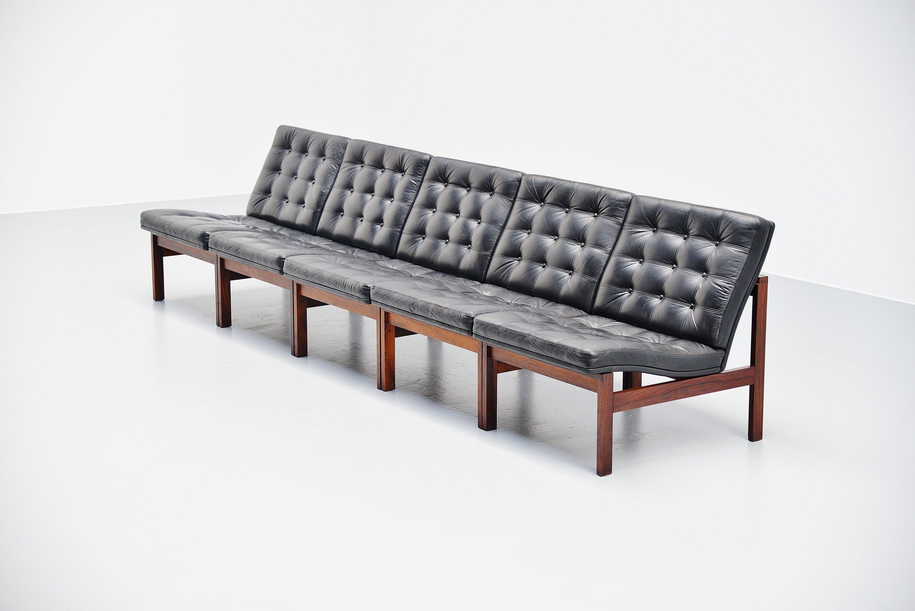 Moduline sofa designed by designer duo Ole Gjerlov Knudsen and Torben Lind. Manufactured by France & Son, Denmark 1962. The sofa has a solid rosewood frame and black leather seats with tufted pattern at the front. The leather is still in great