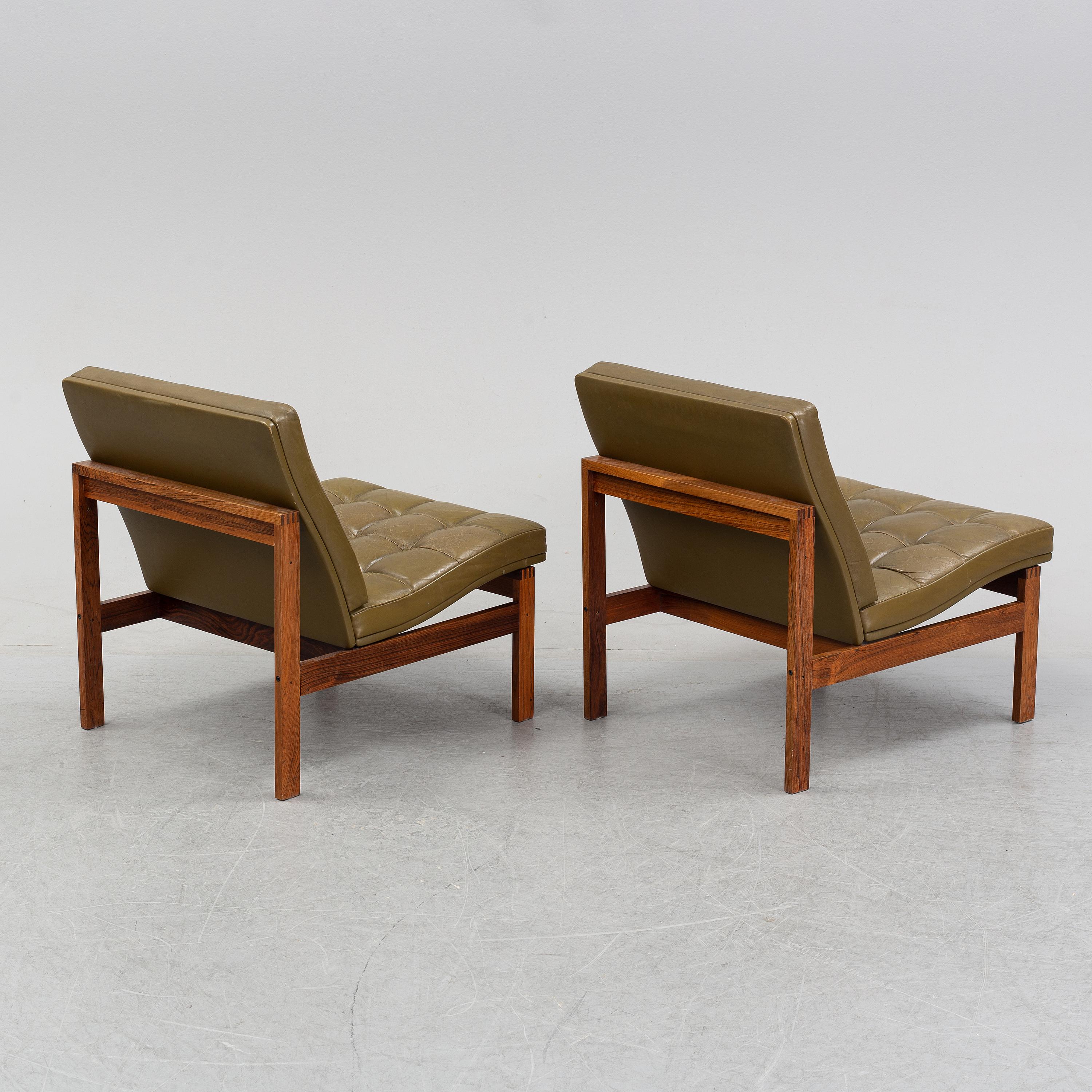 Beautiful set of Moduline easy chairs in its original olive green leather and solid wood designed by Ole Gjerlov Knudsen & Torben Lind for France & Son, Denmark 1962. 
 Overall, this set is in good original condition.
A pair available price for 1