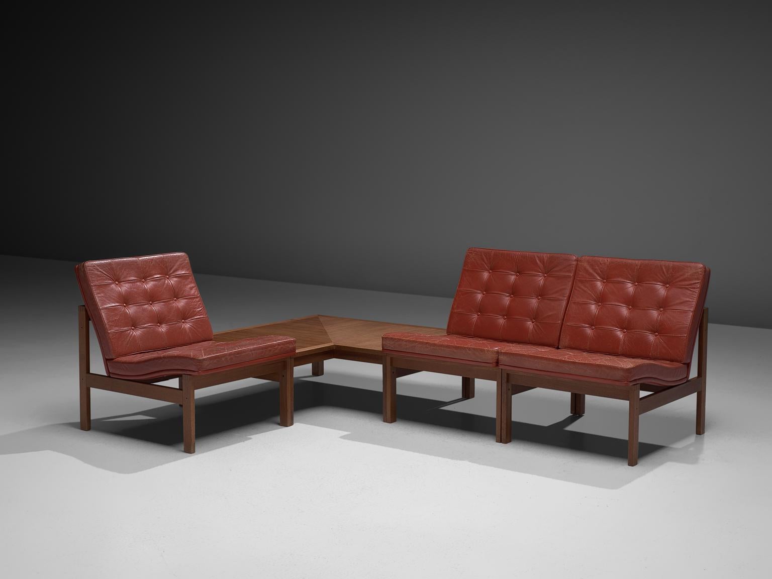 Ole Gjerløv-Knudsen & Torben Lind for France & Søn, three moduline lounge chairs, teak and red leather and one teak tables, Denmark, 1962 

Modern and beautiful colored modular set of slipper chairs and teak table. It consists of three modular easy